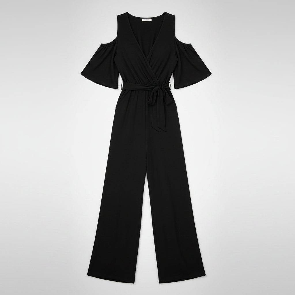 Woman wearing a black off-shoulder jumpsuit on a white background