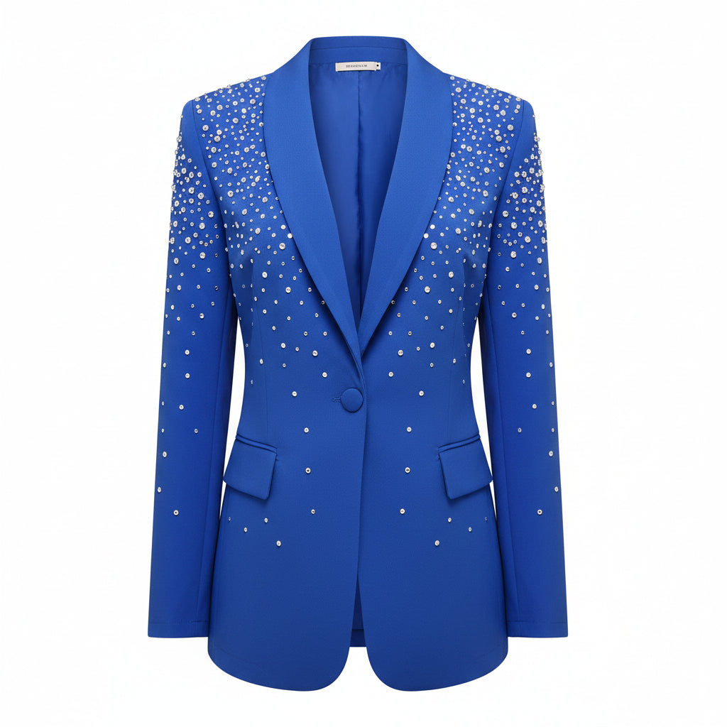 Person wearing a blue blazer with sparkling embellishments on a gray background