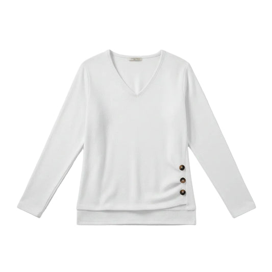 A woman wearing a white long-sleeve V-neck sweater with three dark brown buttons on the side, paired with blue jeans.