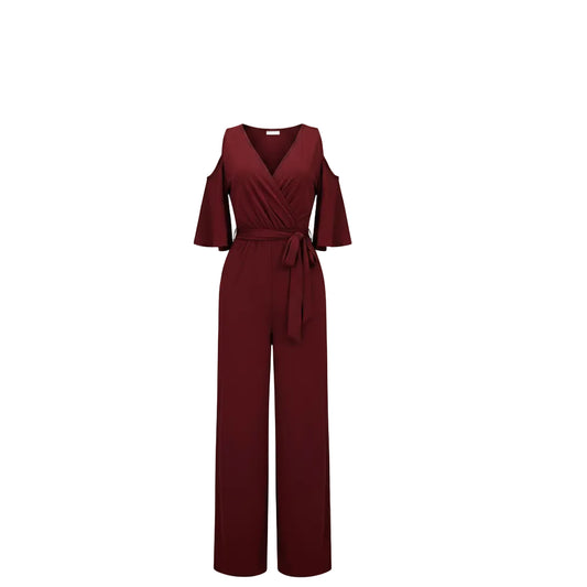 Woman wearing a brown off-shoulder jumpsuit on a white background