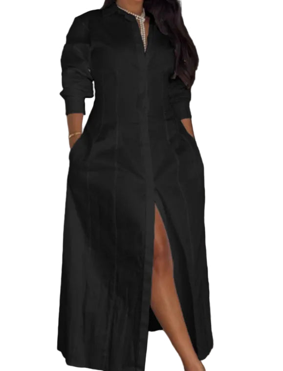 Person wearing a long black dress with a high slit in a room.
